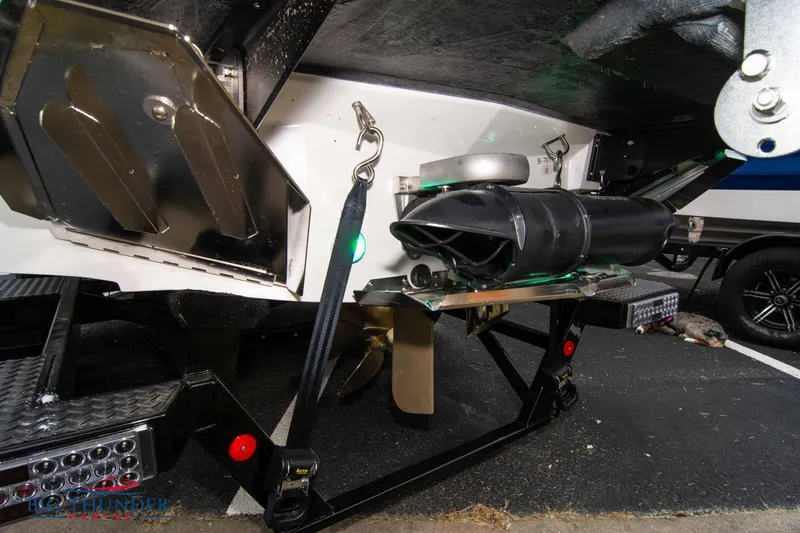Slide: The Image of 2023 MasterCraft X24 boat underside showing propeller and exhaust system. - 7