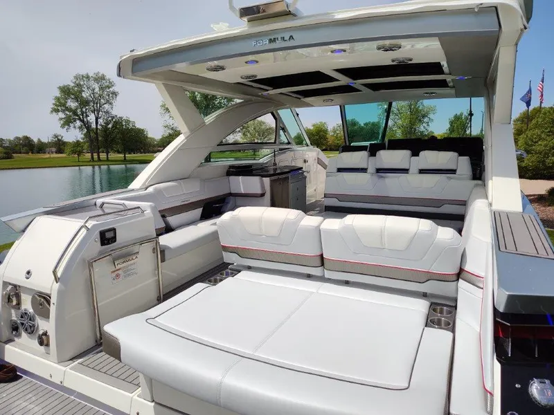 Slide: The Image of 2017 Formula 430 Super Sport Crossover luxury boat interior with white seating. - 19