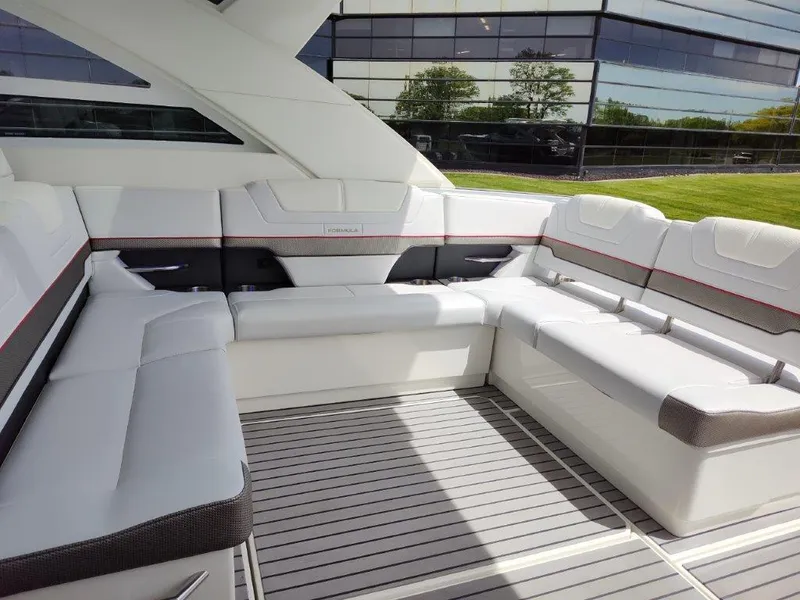 Slide: The Image of 2017 Formula 430 Super Sport Crossover boat interior with white seating and modern design. - 21