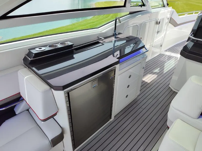 Slide: The Image of Interior of 2017 Formula 430 Super Sport Crossover with kitchenette and seating area. - 25