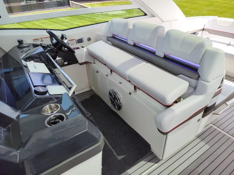 Slide: The Image of Interior of a 2017 Formula 430 Super Sport Crossover boat with modern seating and control panel. - 28