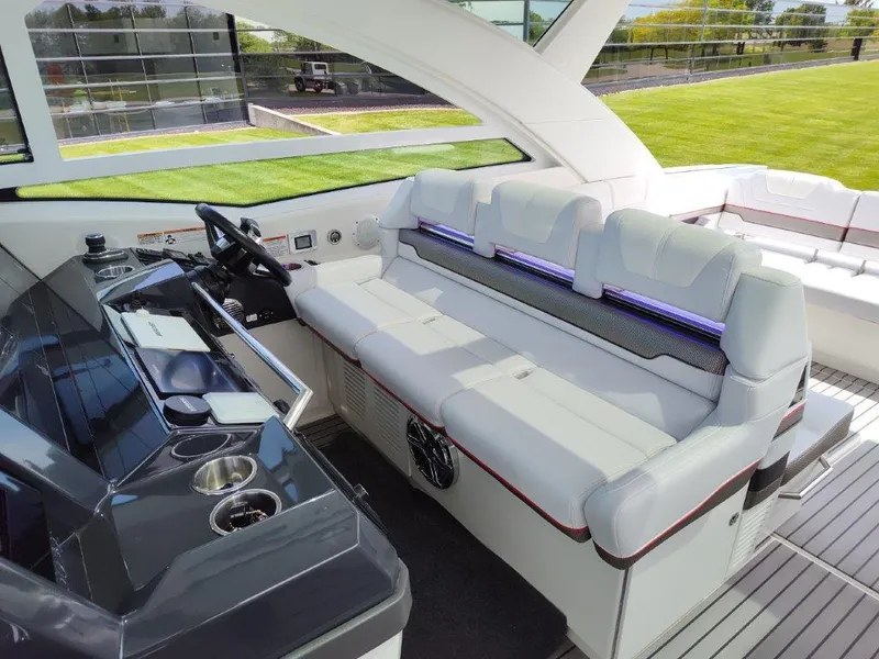 Slide: The Image of Interior of a 2017 Formula 430 Super Sport Crossover boat with white seating and modern dashboard. - 29
