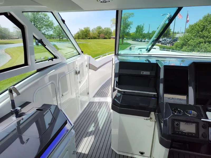 Slide: The Image of Interior of 2017 Formula 430 Super Sport Crossover boat with modern helm and seating area. - 30