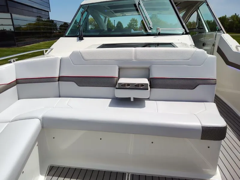 Slide: The Image of 2017 Formula 430 Super Sport Crossover boat interior seating with cup holders. - 34