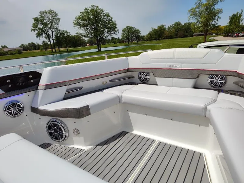 Slide: The Image of 2017 Formula 430 Super Sport Crossover boat interior with white seating and lake view. - 36