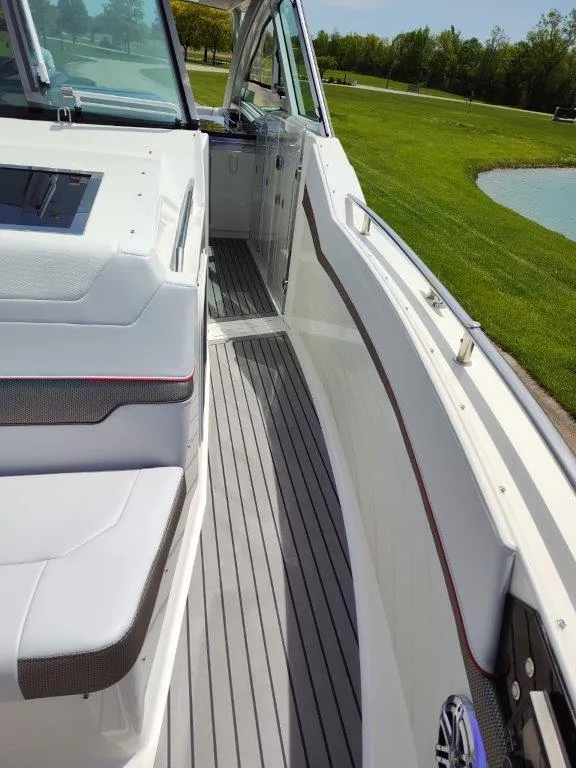 Slide: The Image of 2017 Formula 430 Super Sport Crossover boat interior with white seating and grey flooring. - 37