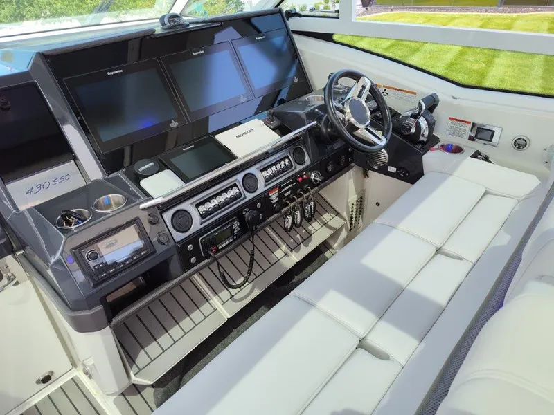 Slide: The Image of Cockpit of a 2017 Formula 430 Super Sport Crossover with advanced navigation systems. - 38