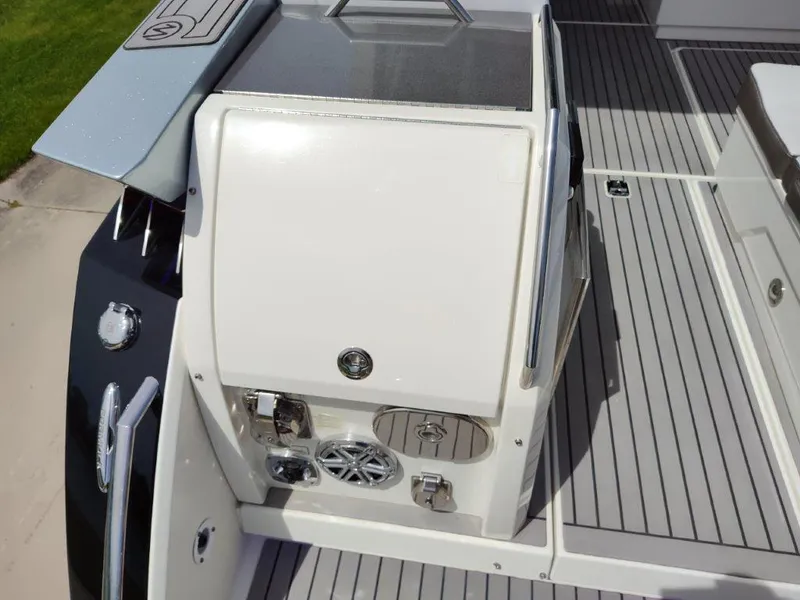 Slide: The Image of 2017 Formula 430 Super Sport Crossover boat deck with storage compartment and control panel. - 40