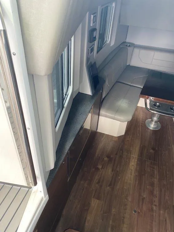 Slide: The Image of Interior of 2017 Formula 430 Super Sport Crossover with seating and wooden flooring. - 8