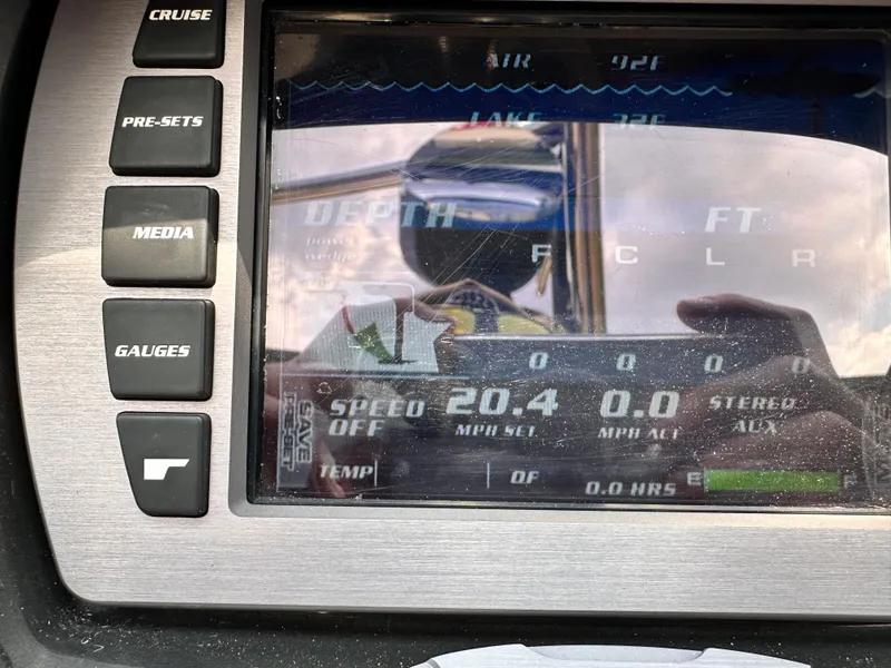 Slide: The Image of 2014 Malibu VTX WAKESETTER dashboard display showing speed, depth, and air temperature. - 14