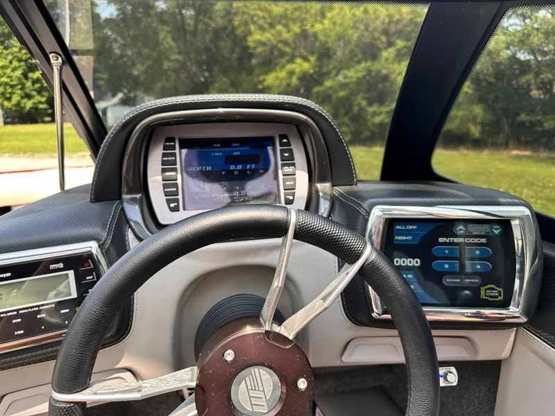 Slide: The Image of 2014 Malibu VTX Wakesetter dashboard with steering wheel and digital displays. - 15