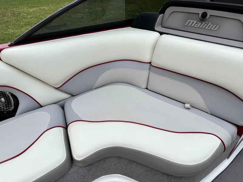 Slide: The Image of 2014 Malibu VTX Wakesetter boat interior with white and gray seating. - 8
