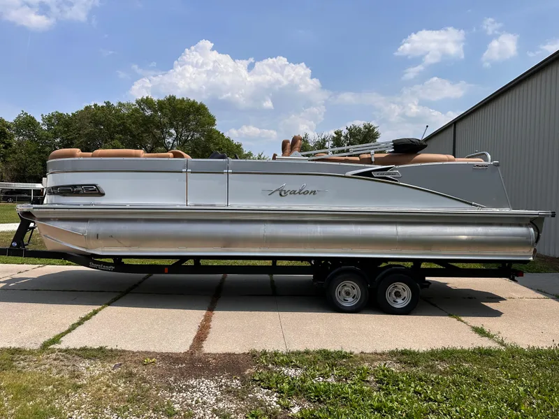 The Image of 2023 Avalon Catalina Quad Lounger 25 pontoon boat on trailer. - 1