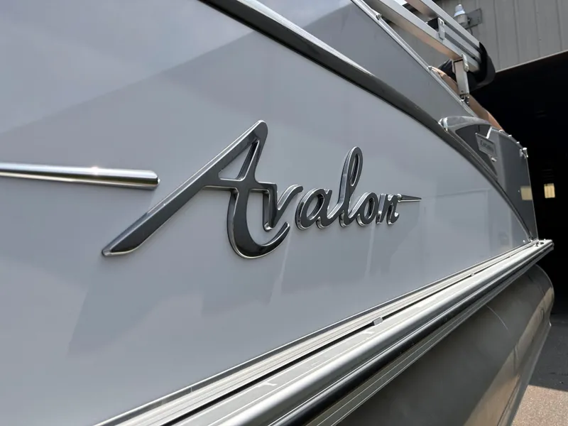 Slide: The Image of 2023 Avalon Catalina Quad Lounger 25 boat side view with logo. - 17