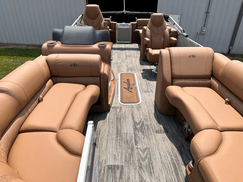 Slide: The Image of 2023 Avalon Catalina Quad Lounger 25 with luxurious tan seating and spacious layout. - 3