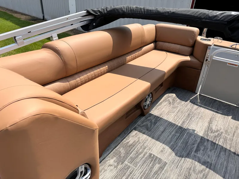 Slide: The Image of 2023 Avalon Catalina Quad Lounger 25 with tan leather seating and gray flooring. - 4