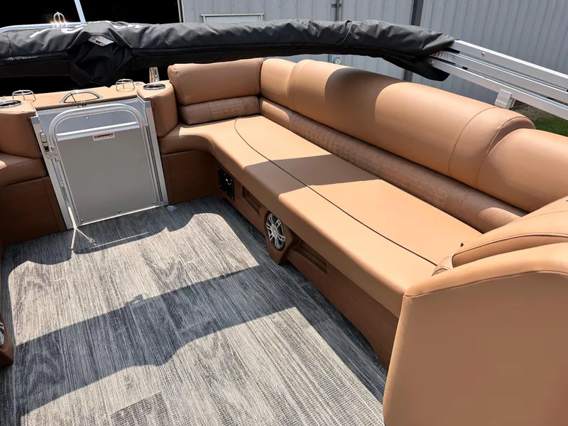 Slide: The Image of 2023 Avalon Catalina Quad Lounger 25 interior with tan seating and gray flooring. - 5