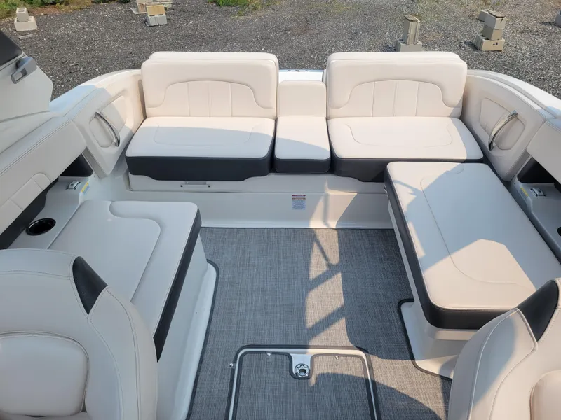 Slide: The Image of 2018 Chaparral 257 SSX boat interior with white and black seating. - 13