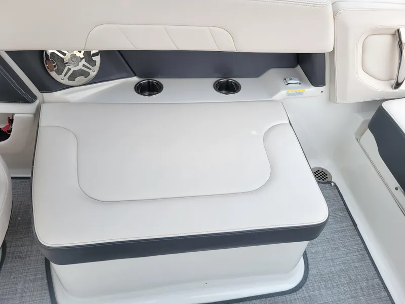 Slide: The Image of 2018 Chaparral 257 SSX boat seating area with cup holders and speaker. - 14