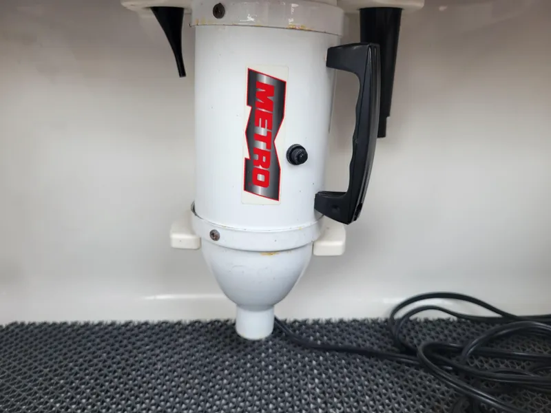 Slide: The Image of 2018 Chaparral 257 SSX boat with Metro vacuum cleaner in storage compartment. - 16