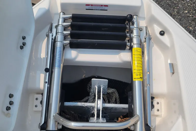 Slide: The Image of 2018 Chaparral 257 SSX boat anchor storage with ladder. - 23