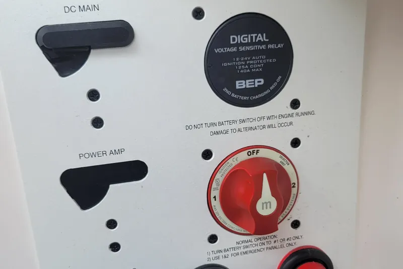 Slide: The Image of Control panel of a 2018 Chaparral 257 SSX boat with digital voltage relay. - 24