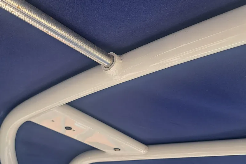 Slide: The Image of Close-up of 2018 Chaparral 257 SSX boat's blue canopy and white frame. - 30