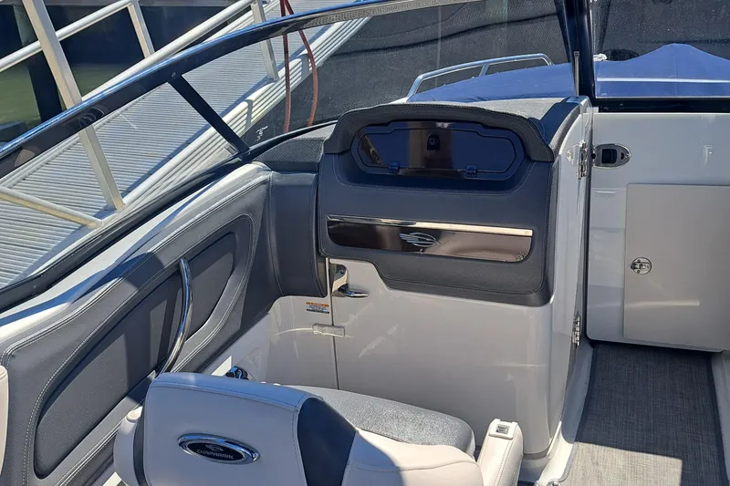 Slide: The Image of Interior of 2018 Chaparral 257 SSX boat, featuring sleek seating and modern dashboard design. - 37