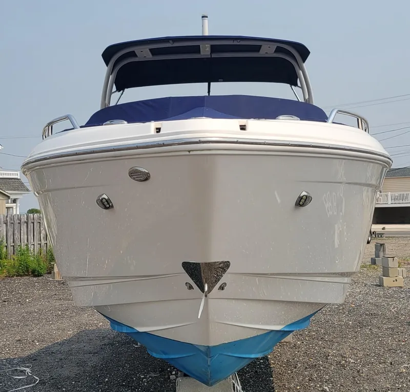 Slide: The Image of 2018 Chaparral 257 SSX boat front view on land. - 4