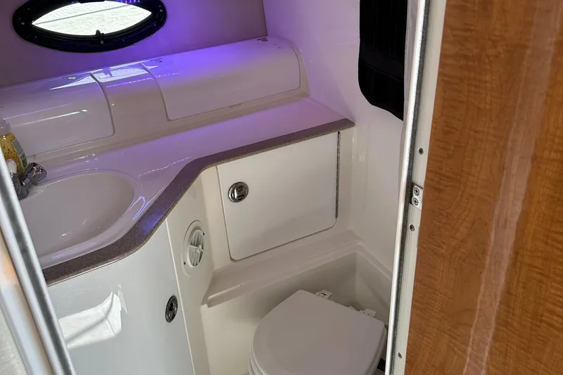Slide: The Image of 2003 Regal 3260 Commodore boat bathroom with sink and toilet. - 17