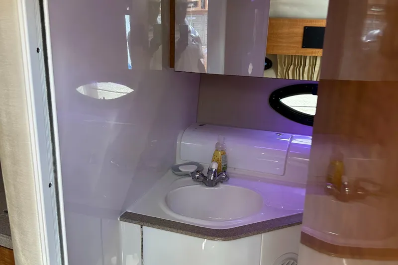 Slide: The Image of 2003 Regal 3260 Commodore yacht bathroom with sink and mirror. - 18