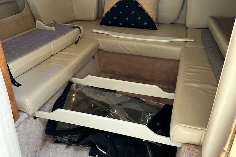 Slide: The Image of Interior seating area of 2003 Regal 3260 Commodore boat with storage compartment. - 20