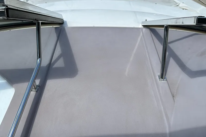 Slide: The Image of 2003 Regal 3260 Commodore boat deck with stainless steel railings. - 25