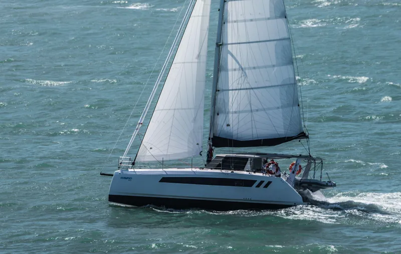Slide: The Image of 2025 Seawind 1170 sailing catamaran on open water. - 10