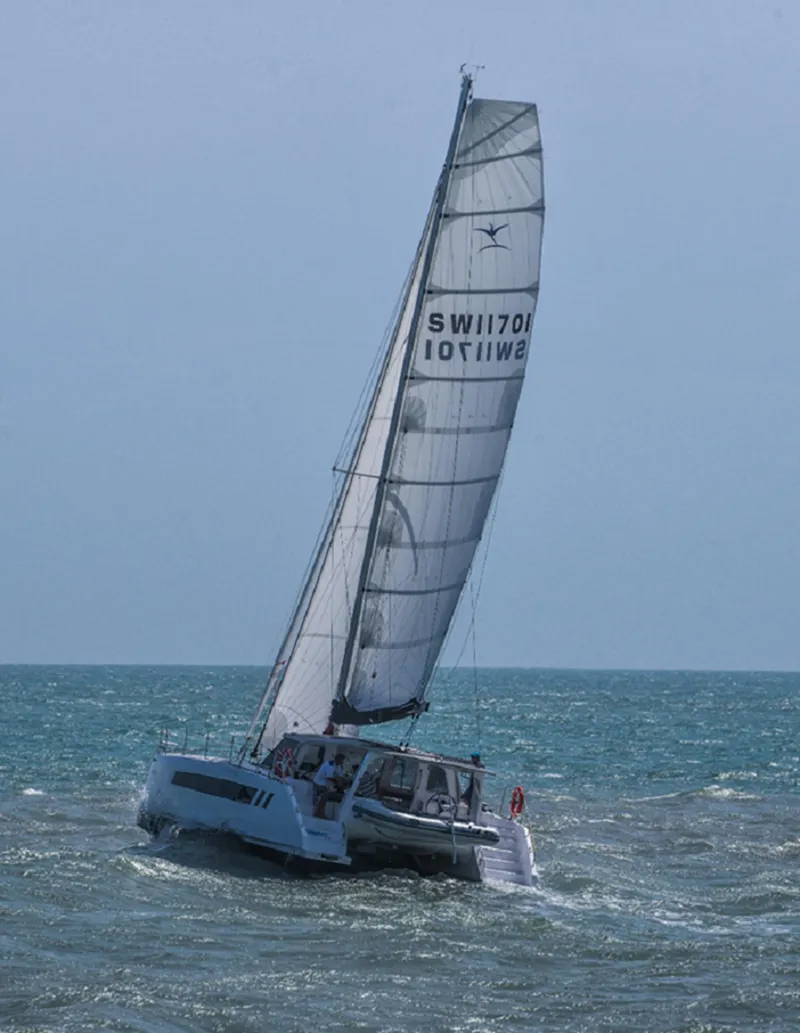 Slide: The Image of 2025 Seawind 1170 sailing catamaran on open water. - 14