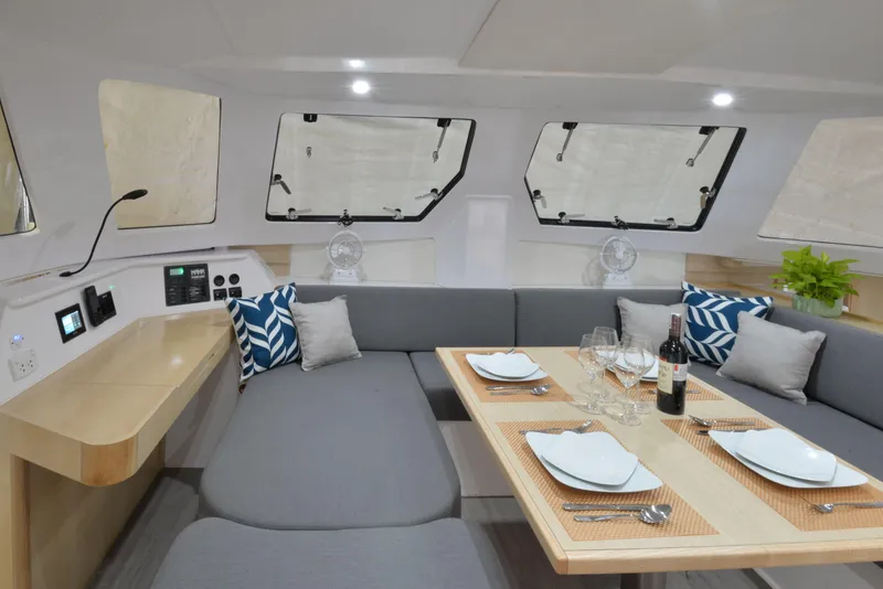 Slide: The Image of Modern interior of 2025 Seawind 1170 yacht with dining table set for four. - 19