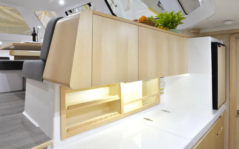 Slide: The Image of Modern kitchen interior of 2025 Seawind 1170 yacht with wooden cabinets and sleek design. - 21