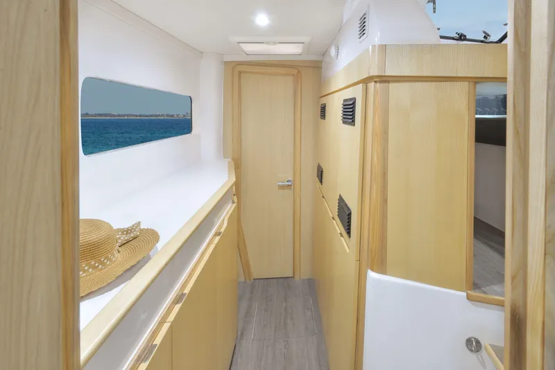 Slide: The Image of Interior of 2025 Seawind 1170 catamaran with wooden finishes and ocean view. - 27