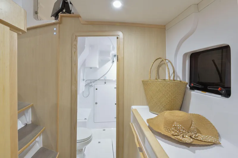 Slide: The Image of Interior of 2025 Seawind 1170 yacht with bathroom, stairs, and accessories. - 31