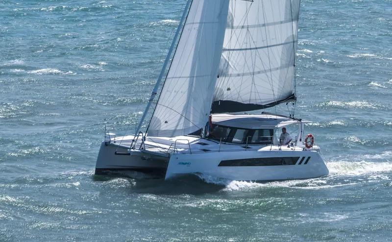Slide: The Image of 2025 Seawind 1170 catamaran sailing on open water. - 5