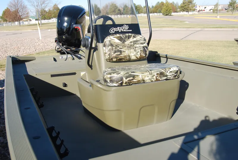 Slide: The Image of 2023 Tracker Grizzly 2072 CC boat with camo seats and outboard motor. - 4