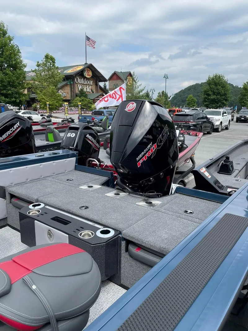 Slide: The Image of 2023 Ranger VX1888 WT boat with Mercury outboard motor in parking lot. - 1