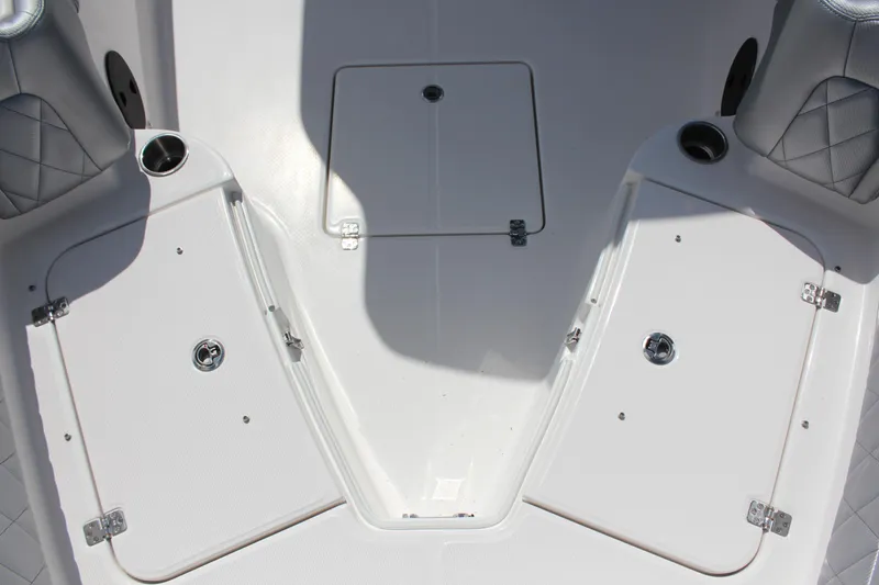 Slide: The Image of 2023 Blue Wave 2600 Makaira boat deck with storage compartments. - 10