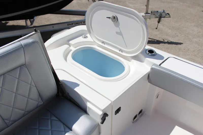 Slide: The Image of 2023 Blue Wave 2600 Makaira boat interior with open storage compartment. - 18