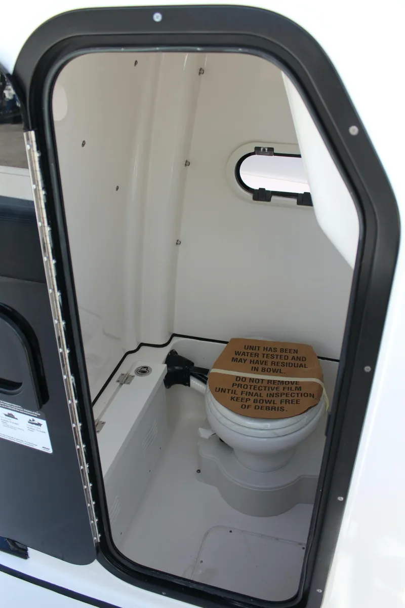Slide: The Image of 2023 Blue Wave 2600 Makaira boat interior bathroom with toilet. - 21
