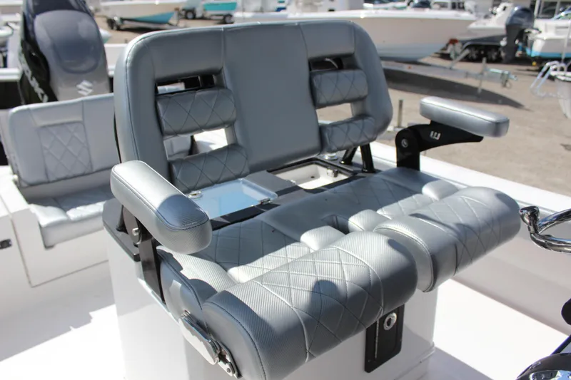 Slide: The Image of 2023 Blue Wave 2600 Makaira boat with luxurious gray seating and armrests. - 8