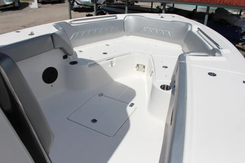 Slide: The Image of 2023 Blue Wave 2600 Makaira boat interior, spacious seating and storage compartments. - 9
