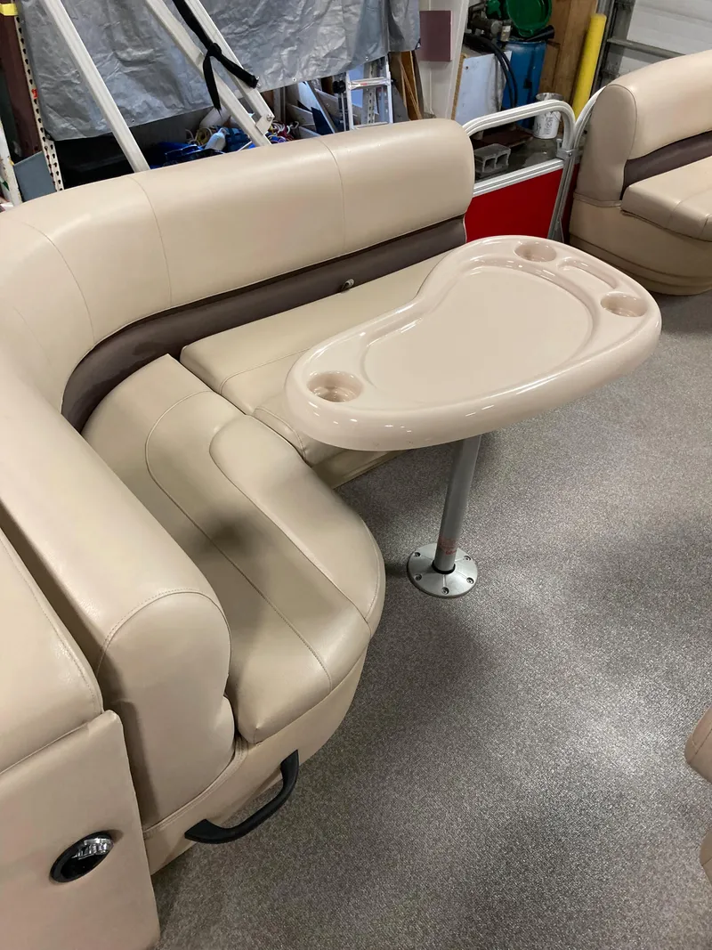 Slide: The Image of 2017 Sun Tracker Party Barge 20 DLX interior seating with table. - 8