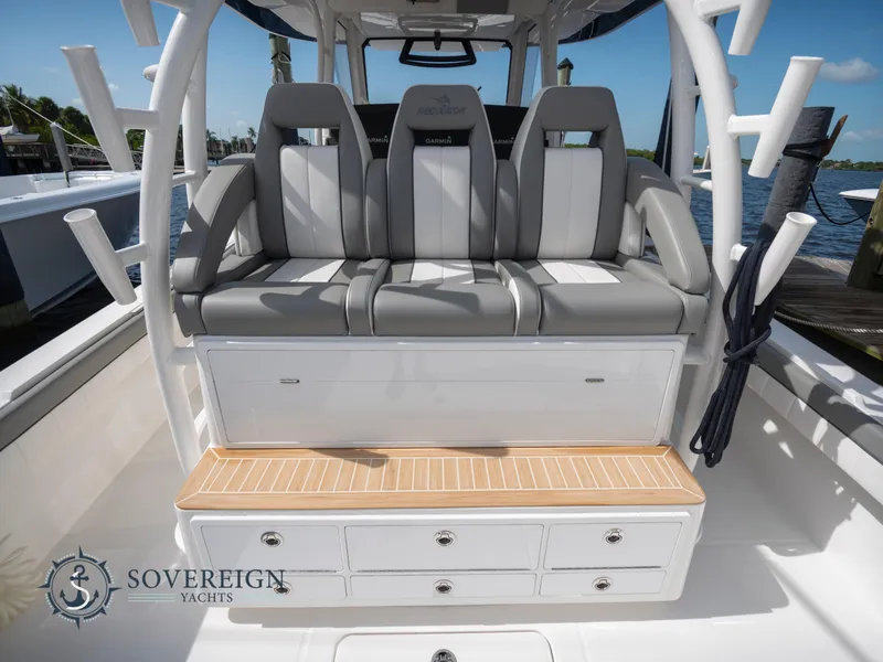 Slide: The Image of 2023 Regulator 41 boat seating area with storage drawers, Sovereign Yachts logo. - 11