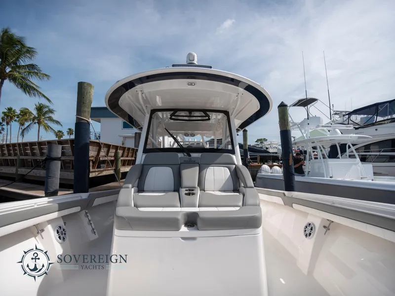 Slide: The Image of 2023 Regulator 41 boat docked at a marina with Sovereign Yachts logo. - 16